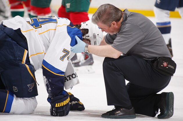 ST. PAUL, MN - APRIL 10: T.J. Oshie #74 of the St. Louis Blues is checked on by a member of the St. Louis Blues training staff during the game against the Minnesota Wild on April 10, 2014 at the Xcel Energy Center in St. Paul, Minnesota. (Photo by Bruce Kluckhohn/NHLI via Getty Images) ST. PAUL, MN - APRIL 10: T.J. Oshie #74 of the St. Louis Blues is checked on by a member of the St. Louis Blues training staff during the game against the Minnesota Wild on April 10, 2014 at the Xcel Energy Center in St. Paul, Minnesota. (Photo by Bruce Kluckhohn/NHLI via Getty Images)
