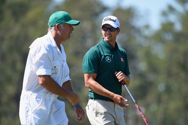 AUGUSTA, GA - APRIL 10:  Adam Scott of Australia and caddie Steve Williams wait on a green during the first round of the 2014 Masters Tournament at Augusta National Golf Club on April 10, 2014 in Augusta, Georgia.  (Photo by Harry How/Getty Images)