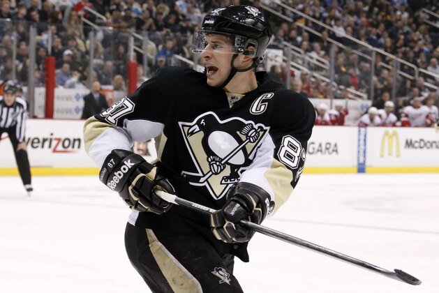 Pittsburgh Penguins' Sidney Crosby (87) works during a power play in the second period of an NHL hockey game against the Detroit Red Wings in Pittsburgh, Wednesday, April 9, 2014. The Penguins won 4-3 in a shootout. (AP Photo/Gene J. Puskar)