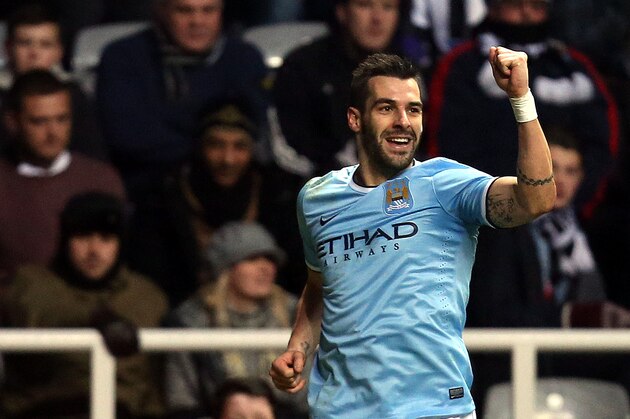 Manchester City's Alvaro Negredo celebrates his goal during their English Premier League soccer match against Newcastle United at St James' Park, Newcastle, England, Sunday, Jan. 12, 2014. (AP Photo/Scott Heppell)