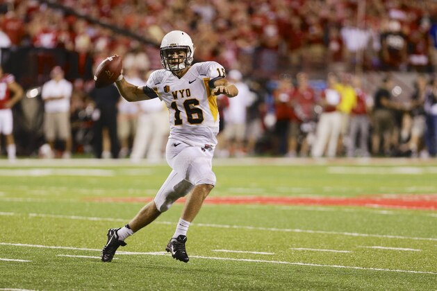 Wyoming quarterback Brett Smith looks for an open player in the second half of an NCAA college football game in Lincoln, Neb., Saturday, Aug. 31, 2013. (AP Photo/Nati Harnik)