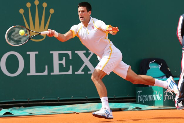 Novak Djokovic of Serbia plays a return to Spain's Rafael Nadal during their final match of the Monte Carlo Tennis Masters tournament in Monaco, Sunday, April 21, 2013. (AP Photo/Claude Paris)