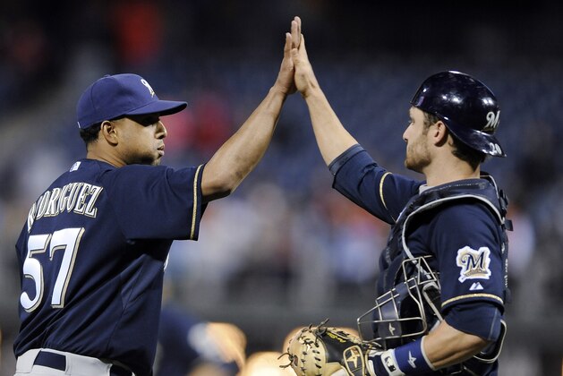 Milwaukee Brewers' Francisco Rodriguez (57) celebrates with Jonathan Lucroy at the end of a baseball game against the Philadelphia Phillies on Thursday, April 10, 2014, in Philadelphia. The Brewers won 6-2. (AP Photo/Michael Perez)