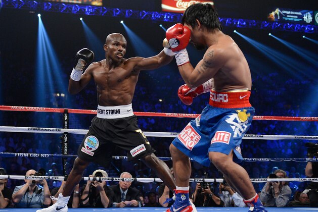 LAS VEGAS, NV - JUNE 09: (L-R) Timothy Bradley lands a left to the head of Manny Pacquiao during their WBO welterweight title fight at MGM Grand Garden Arena on June 9, 2012 in Las Vegas, Nevada. (Photo by Kevork Djansezian/Getty Images) LAS VEGAS, NV - JUNE 09: (L-R) Timothy Bradley lands a left to the head of Manny Pacquiao during their WBO welterweight title fight at MGM Grand Garden Arena on June 9, 2012 in Las Vegas, Nevada. (Photo by Kevork Djansezian/Getty Images)