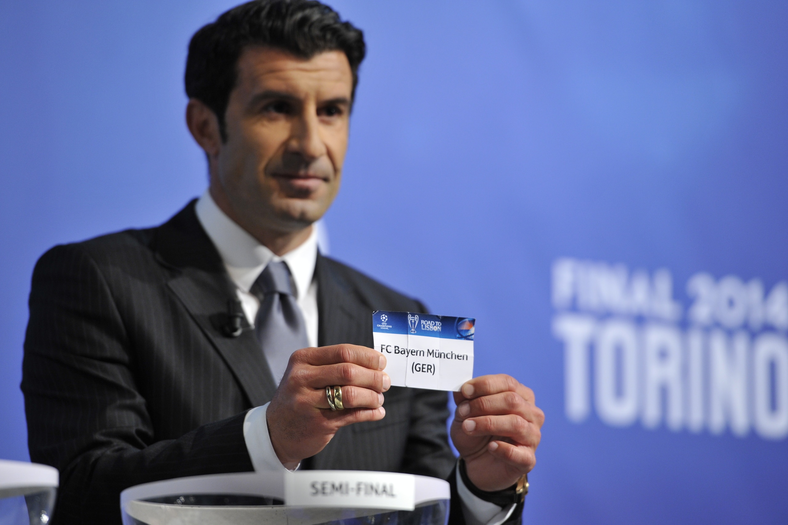NYON, SWITZERLAND - APRIL 11:  Ambassador for the final Luis Figo draws Bayern Munich during the UEFA Champions League 2013/14 season semi-finals draw at the UEFA headquarters, The House of European Football, on April 11, 2014 in Nyon, Switzerland.  (Photo by Harold Cunningham/Getty Images for UEFA)