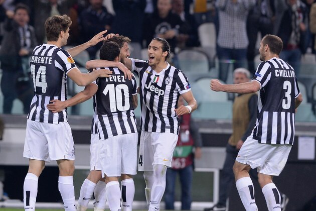TURIN, ITALY - APRIL 10:  Claudio Marchisio of Juventus (C) celebrates scoring the second goal during the UEFA Europa League quarter final match between Juventus and Olympique Lyonnais at Juventus Arena on April 10, 2014 in Turin, Italy.  (Photo by Claudio Villa/Getty Images)