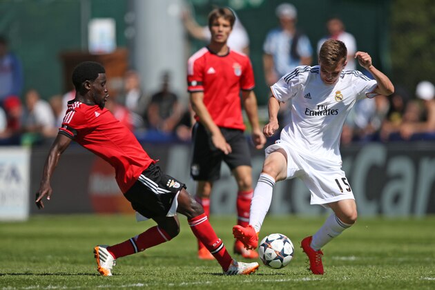 NYON, SWITZERLAND - APRIL 11: Estrela of SL Benfica (L) fights for the ball with Aleix Febas of Real Madrid during the UEFA Youth League Semi Final match between Real Madrid and Benfica Lisbon at Colovray Stadion on April 11, 2014 in Nyon, Switzerland. (Photo by Philipp Schmidli/Bongarts/Getty Images) NYON, SWITZERLAND - APRIL 11: Estrela of SL Benfica (L) fights for the ball with Aleix Febas of Real Madrid during the UEFA Youth League Semi Final match between Real Madrid and Benfica Lisbon at Colovray Stadion on April 11, 2014 in Nyon, Switzerland. (Photo by Philipp Schmidli/Bongarts/Getty Images)