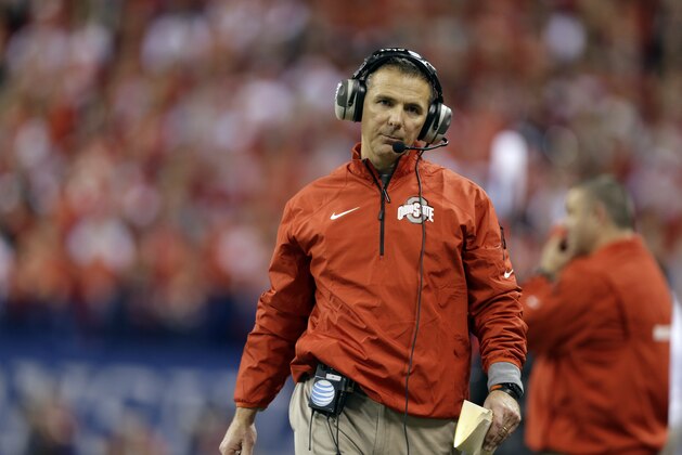 Ohio State coach Urban Meyer walks the sideline during the first half of an Big Ten Conference championship NCAA college football game against Michigan State Saturday, Dec. 7, 2013, in Indianapolis. (AP Photo/Michael Conroy)