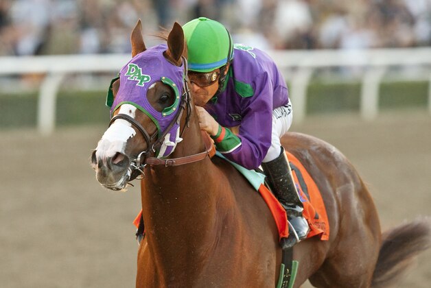 In a photo provided by Benoit Photo, California Chrome and jockey Victor Espinoza win the $250,000 California Cup Derby horse race, Saturday, Jan. 25, 2014, at Santa Anita in Arcadia, Calif. (AP Photo/Benoit Photo)