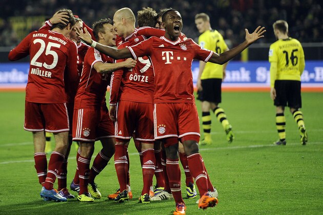 Bayern's team celebrate their goal during the German Bundesliga soccer match between Borussia Dortmund and Bayern Munich in Dortmund, Germany, Saturday, Nov. 23, 2013. Bayern's David Alaba of Austria in front. (AP Photo/Martin Meissner) Bayern's team celebrate their goal during the German Bundesliga soccer match between Borussia Dortmund and Bayern Munich in Dortmund, Germany, Saturday, Nov. 23, 2013. Bayern's David Alaba of Austria in front. (AP Photo/Martin Meissner)