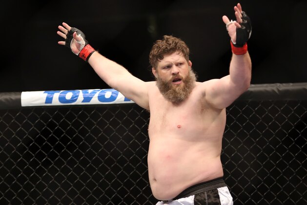 Roy Nelson celebrates his win over Cheick Kongo after their UFC 159 Mixed Martial Arts heavyweight bout in Newark, NJ, Saturday, April 27,2013.  Nelson won via first round KO. (AP Photo/Gregory Payan)