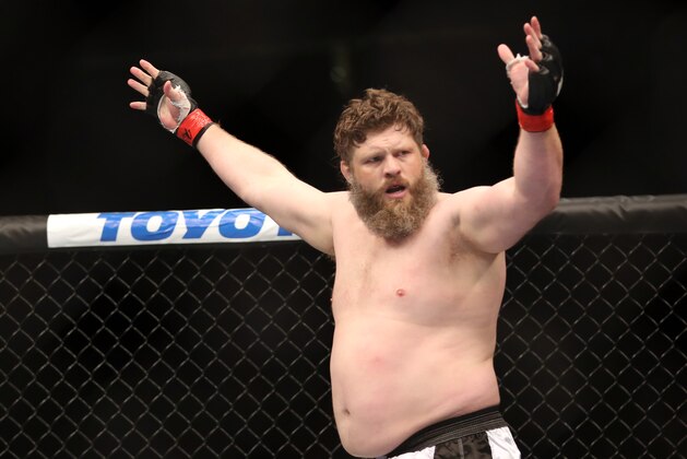 Roy Nelson celebrates his win over Cheick Kongo after their UFC 159 Mixed Martial Arts heavyweight bout in Newark, NJ, Saturday, April 27,2013.  Nelson won via first round KO. (AP Photo/Gregory Payan)