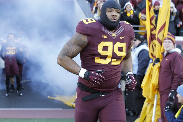 Minnesota defensive lineman Ra'Shede Hageman (99) takes the field prior to an NCAA college football game against Wisconsin in Minneapolis Saturday, Nov. 23, 2013. (AP Photo/Ann Heisenfelt)