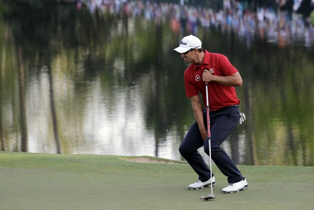 Adam Scott, of Australia, reacts after missing a putt on the 16th green during the second round of the Masters golf tournament Friday, April 11, 2014, in Augusta, Ga. (AP Photo/David J. Phillip)