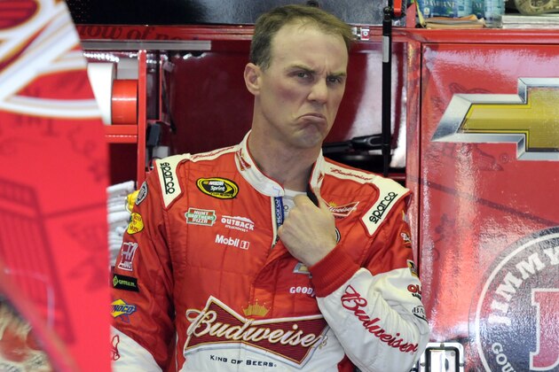 Kevin Harvick reacts as he talks to crew members during a NASCAR Sprint Cup series auto race practice at Darlington Speedway in Darlington, S.C., Friday, April 11, 2014. (AP Photo/Mike McCarn)