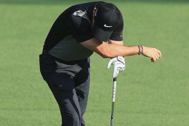 AUGUSTA, GA - APRIL 11:  Rory McIlroy of Northern Ireland reacts to a poor shot on the 13th hole during the second round of the 2014 Masters Tournament at Augusta National Golf Club on April 11, 2014 in Augusta, Georgia.  (Photo by David Cannon/Getty Images)