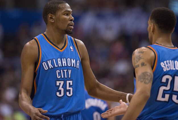 Apr 9, 2014; Los Angeles, CA, USA; Oklahoma City Thunder forward Kevin Durant (35) celebrates with guard Thabo Sefolosha (25) after scoring against the Los Angeles Clippers during the third quarter at Staples Center. The Thunder won 107-101. Mandatory Credit: Kelvin Kuo-USA TODAY Sports