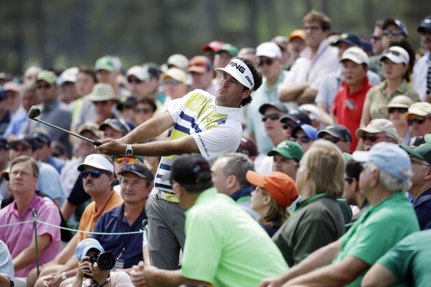 Bubba Watson watches his shot out of the gallery on the 18th hole during the second round of the Masters golf tournament Friday, April 11, 2014, in Augusta, Ga. (AP Photo/Darron Cummings)