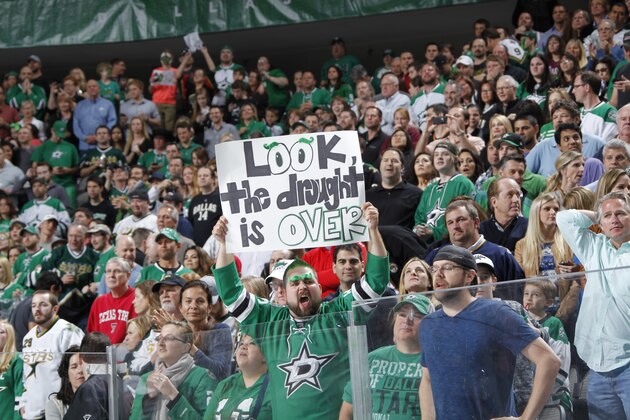 DALLAS, TX - APRIL 11: Dallas Stars fans celebrate a playoff birth clenching win for the first time in more than 5 seasons against the St. Louis Blues at the American Airlines Center on April 11, 2014 in Dallas, Texas. (Photo by Glenn James/NHLI via Getty Images)