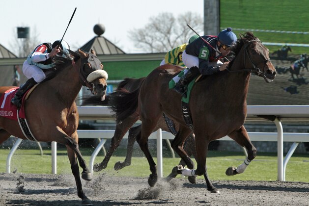 Last Full Measure, right, under jockey Corey Nakatani, holds off late-charging Byrama, far left, and Jamaican Smoke (obscured) to win the Madison Stakes horse race at Keeneland Race Course in Lexington, Ky., Saturday, April 13, 2013. (AP Photo/Garry Jones)