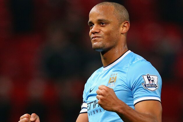 MANCHESTER, ENGLAND - MARCH 25:  Vincent Kompany of Manchester City celebrates at the end of the Barclays Premier League match between Manchester United and Manchester City at Old Trafford on March 25, 2014 in Manchester, England.  (Photo by Alex Livesey/Getty Images)