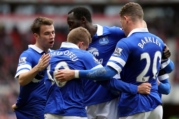 Everton's Gerard Deulofeu, center, celebrates after his shot was turned into the goal by Sunderland's Wes Brown during their English Premier League soccer match at the Stadium of Light, Sunderland, England, Saturday, April 12, 2014. (AP Photo/Scott Heppell)