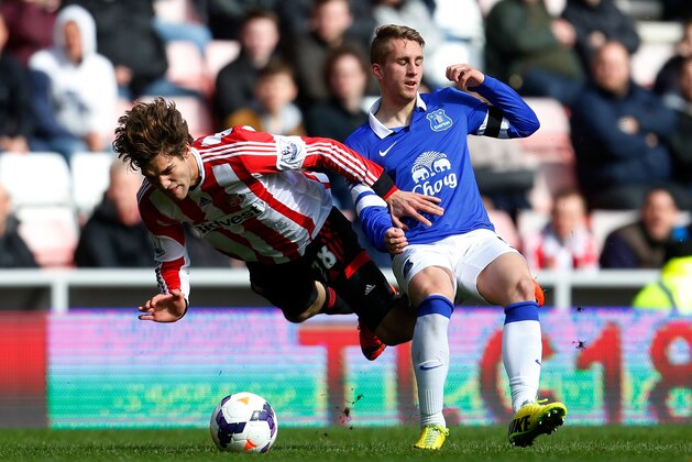 SUNDERLAND, ENGLAND - APRIL 12: Marcos Alonso (L) of Sunderland in action with Gerard Deulofeu of Everton during the Barclays Premier League match between Sunderland and Everton at the Stadium of Light on April 12, 2014 in Sunderland, England. (Photo by Paul Thomas/Getty Images)