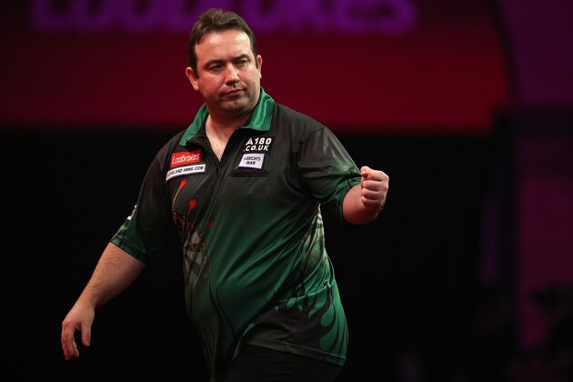 LONDON, ENGLAND - DECEMBER 22: Brendan Dolan of Northern Ireland celebrates winning a leg during his second round match against Gary Anderson of England during the Ladbrokes.com World Darts Championship on Day Ten at Alexandra Palace on December 22, 2013 in London, England. (Photo by Charlie Crowhurst/Getty Images)