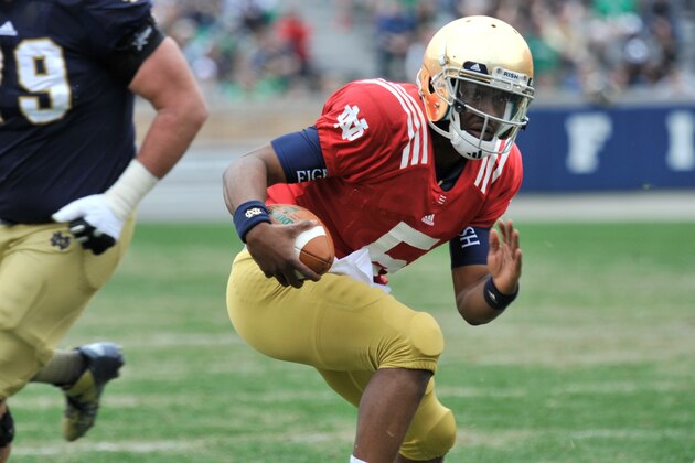 Notre Dame quarterback Everett Golson sprints to the end zone during their spring NCAA college football game Saturday April 12, 2014, in South Bend, Ind. The Blue Gold game marks the end of spring football practice. (AP Photo/Joe Raymond)
