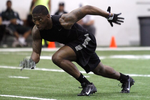 Former Michigan State cornerback Darqueze Dennard runs a drill during pro day for NFL scouts, Tuesday, March 11, 2014, in East Lansing, Mich. (AP Photo/Al Goldis)