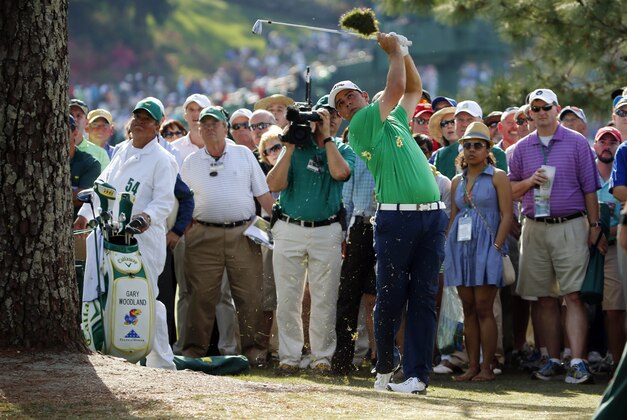Apr 11, 2014; Augusta, GA, USA; Gary Woodland hits back onto the 17th hole after an errant shot into a walk way during the second round of the 2014 The Masters golf tournament at Augusta National Golf Club. Mandatory Credit: Jack Gruber-USA TODAY Sports