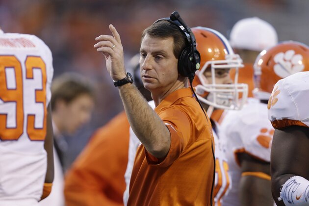 Clemson head coach Dabo Swinney directs his team during the second half of an NCAA college football game in Charlottesville, Va., Saturday, Nov. 2, 2013.  Clemson won 59-10.  (AP Photo/Steve Helber)