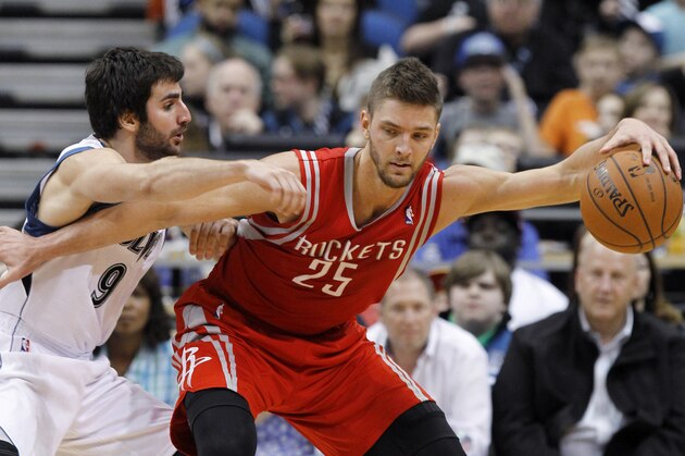 Houston Rockets forward Chandler Parsons (25) tries to drive against Minnesota Timberwolves guard Ricky Rubio (9), of Spain, during the third quarter of an NBA basketball game in Minneapolis, Friday, April 11, 2014. The Timberwolves won 112-110. (AP Photo/Ann Heisenfelt) Houston Rockets forward Chandler Parsons (25) tries to drive against Minnesota Timberwolves guard Ricky Rubio (9), of Spain, during the third quarter of an NBA basketball game in Minneapolis, Friday, April 11, 2014. The Timberwolves won 112-110. (AP Photo/Ann Heisenfelt)