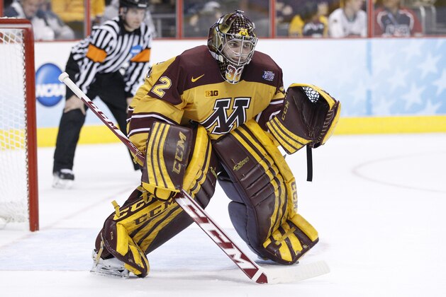 Minnesota's Adam Wilcox in action during the first period of an NCAA men's college hockey Frozen Four tournament game against North Dakota, Thursday, April 10, 2014, in Philadelphia. Minnesota won 2-1. (AP Photo/Chris Szagola)