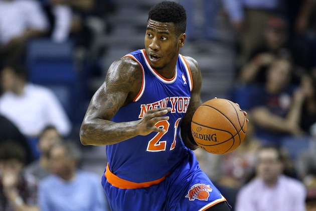 New York Knicks shooting guard Iman Shumpert (21) drives with the ball during the first quarter of an NBA basketball game in New Orleans, Wednesday, Feb. 19, 2014. (AP Photo/Jonathan Bachman)