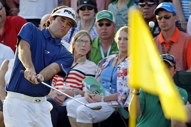 Bubba Watson chips to the 18th green during the third round of the Masters golf tournament Saturday, April 12, 2014, in Augusta, Ga. (AP Photo/David J. Phillip)