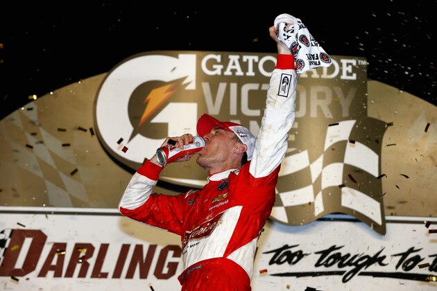 DARLINGTON, SC - APRIL 12:  Kevin Harvick, driver of the #4 Budweiser Chevrolet, celebrates in Victory Lane after winning the NASCAR Sprint Cup Series Bojangles' Southern 500 at Darlington Raceway on April 12, 2014 in Darlington, South Carolina.  (Photo by Jonathan Ferrey/Getty Images)