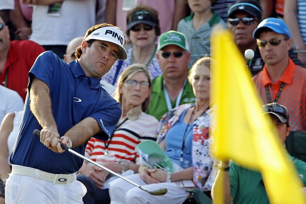 Bubba Watson chips to the 18th green during the third round of the Masters golf tournament Saturday, April 12, 2014, in Augusta, Ga. (AP Photo/David J. Phillip)