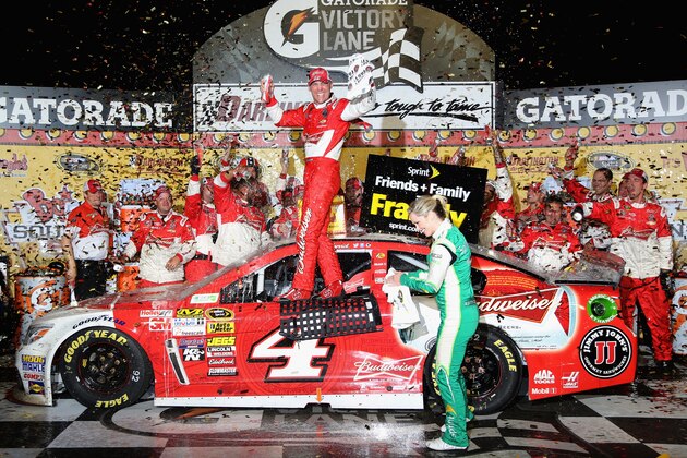 DARLINGTON, SC - APRIL 12:  Kevin Harvick, driver of the #4 Budweiser Chevrolet, celebrates in Victory Lane after winning the NASCAR Sprint Cup Series Bojangles' Southern 500 at Darlington Raceway on April 12, 2014 in Darlington, South Carolina.  (Photo by Jerry Markland/Getty Images)