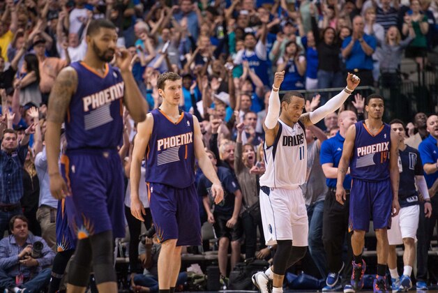 Apr 12, 2014; Dallas, TX, USA; Dallas Mavericks guard Monta Ellis (11) and his team celebrate the win over the Phoenix Suns at the American Airlines Center. The Mavericks defeated the Suns 101-98 and clinched a spot in the NBA playoffs. Mandatory Credit: Jerome Miron-USA TODAY Sports