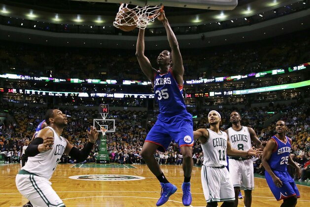 Philadelphia 76ers center Henry Sims (35) dunks against the Boston Celtics during the second half of an NBA basketball game Friday, April 4, 2014, in Boston. The 76ers defeated the Celtics 111-102. (AP Photo/Charles Krupa)