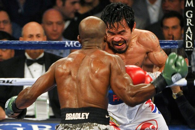 LAS VEGAS, NV - APRIL 12: Timothy Bradley (L) and Manny Pacquiao battle it out during their WBO world welterweight championship boxing match at the MGM Grand Garden Arena on April 12, 2014 in Las Vegas, Nevada. Pacquiao won by unanimous decision. (Photo by David Becker/Getty Images) LAS VEGAS, NV - APRIL 12: Timothy Bradley (L) and Manny Pacquiao battle it out during their WBO world welterweight championship boxing match at the MGM Grand Garden Arena on April 12, 2014 in Las Vegas, Nevada. Pacquiao won by unanimous decision. (Photo by David Becker/Getty Images)