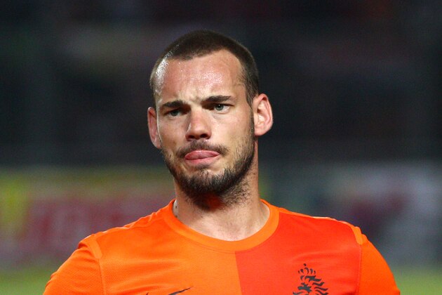 Wesley Sneijder of the Netherlands listens to the national anthems before his friendly soccer match against Indonesia at Gelora Bung Karno stadium in Jakarta, Indonesia, Friday, June 7, 2013. (AP Photo/Dita Alangkara)