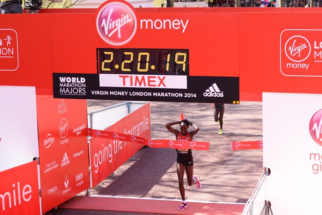 Elite marathon runners from left, Florence Kiplagat of Kenya, Tirunesh Dibaba of Ethiopia, Edna Kiplagat of Kenya, Tiki Gelana of Ethiopia, and Priscah Jeptoo of Kenya, pose for photographers, backdropped by Tower Bridge during a photocall in London, Thursday April 10, 2014. The London marathon takes place on Sunday, April 13. (AP Photo/Lefteris Pitarakis)