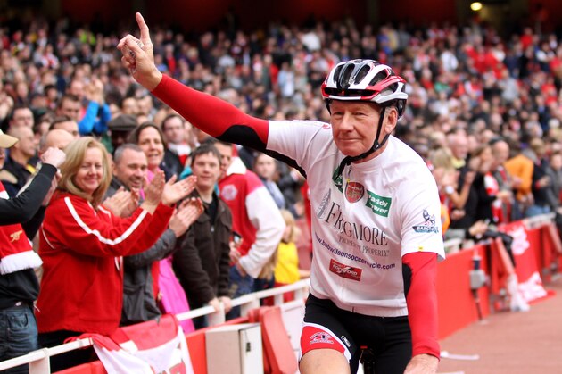 LONDON, ENGLAND - APRIL 02:  Former Arsenal goalkeeper Bob Wilson cycles around the ground to launch his 500 mile cycling challenge during the Barclays Premier League match between Arsenal and Blackburn Rovers at the Emirates Stadium on April 2, 2011 in London, England.  (Photo by Julian Finney/Getty Images)