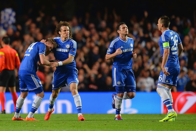 LONDON, ENGLAND - APRIL 08:  David Luiz of Chelsea congratulates Andre Schurrle of Chelsea on scoring their first goal during the UEFA Champions League Quarter Final second leg match between Chelsea and Paris Saint-Germain FC at Stamford Bridge on April 8, 2014 in London, England.  (Photo by Mike Hewitt/Getty Images)