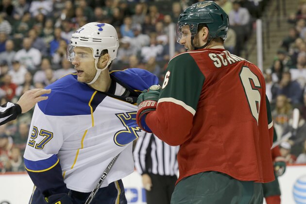Minnesota Wild defenseman Marco Scandella (6) tugs on St. Louis Blues defenseman Alex Pietrangelo's (27) jersey during the second period of an NHL hockey game in St. Paul, Minn., Thursday, April 10, 2014. (AP Photo/Ann Heisenfelt)