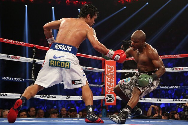 LAS VEGAS, NV - APRIL 12: Manny Pacquiao catches Timothy Bradley off balance at the MGM Grand Garden Arena on April 12, 2014 in Las Vegas, Nevada. (Photo by Jeff Gross/Getty Images) LAS VEGAS, NV - APRIL 12: Manny Pacquiao catches Timothy Bradley off balance at the MGM Grand Garden Arena on April 12, 2014 in Las Vegas, Nevada. (Photo by Jeff Gross/Getty Images)