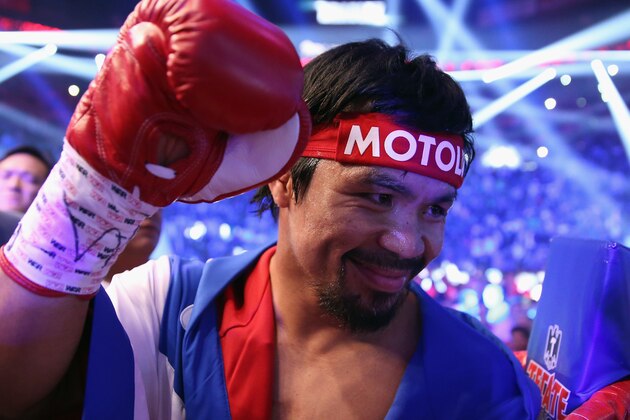 LAS VEGAS, NV - APRIL 12:  Manny Pacquiao acknowledges people in the crowd prior to fighting Timothy Bradley at the MGM Grand Garden Arena on April 12, 2014 in Las Vegas, Nevada.  (Photo by Jeff Gross/Getty Images)