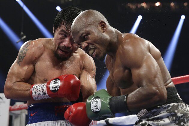 Manny Pacquiao, left, of the Philippines, trades blows with Timothy Bradley, in their WBO welterweight title boxing fight Saturday, April 12, 2014, in Las Vegas. Pacquiao won the bout by unanimous decision. (AP Photo/Isaac Brekken) Manny Pacquiao, left, of the Philippines, trades blows with Timothy Bradley, in their WBO welterweight title boxing fight Saturday, April 12, 2014, in Las Vegas. Pacquiao won the bout by unanimous decision. (AP Photo/Isaac Brekken)